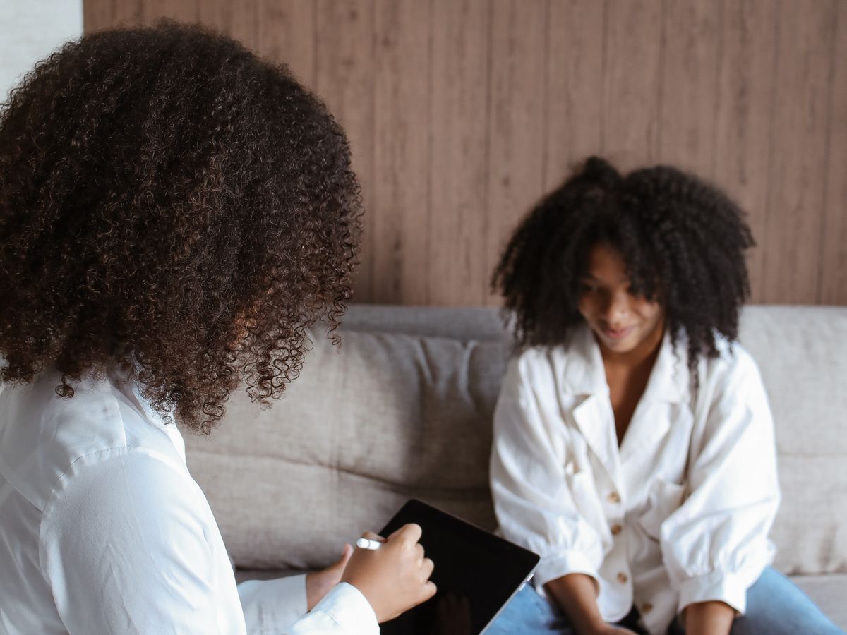 A warm, supportive counseling conversation between two people